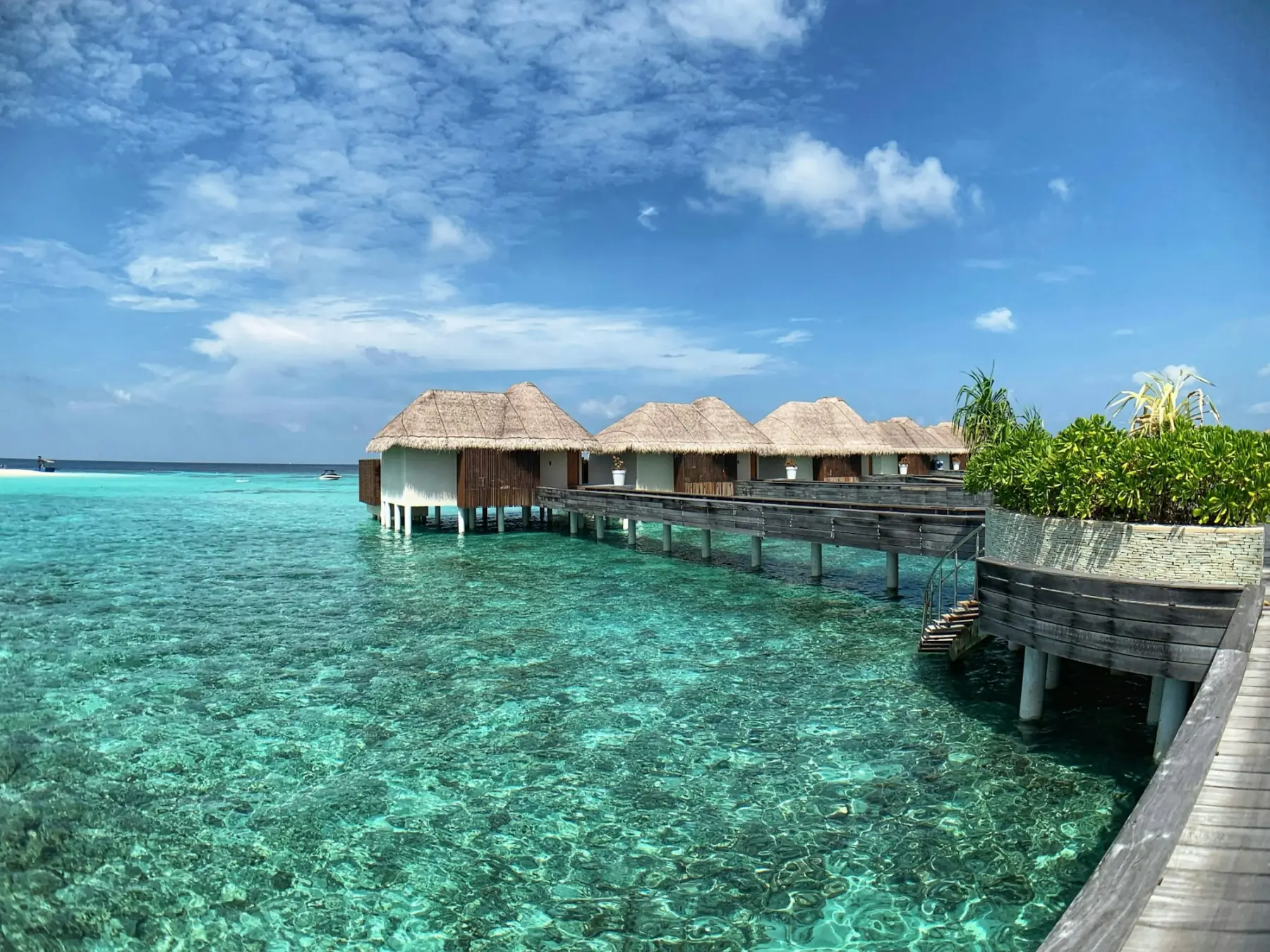 Overwater villas over clear turquoise water, Maldives